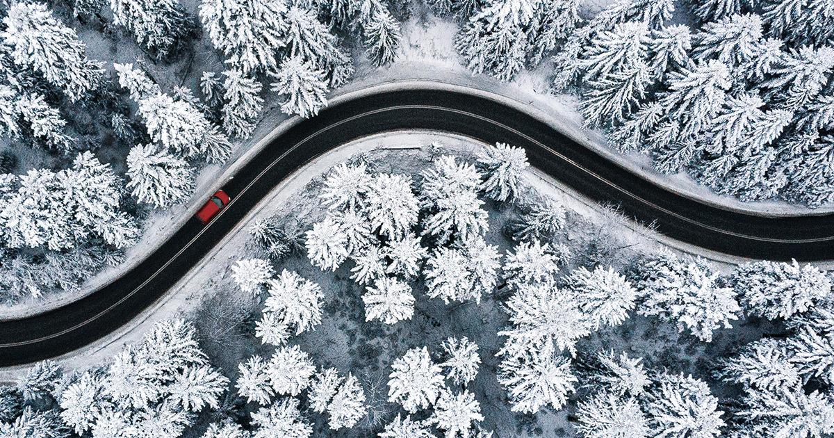 It's Beginning to Look a Lot Like Christmas - overhead view of car driving between snowy landscape